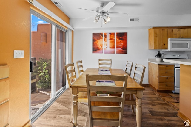3418 E La Camino, Moab, UT 84532 - dining area with baseboards, visible vents, wood finished floors, and ceiling fan