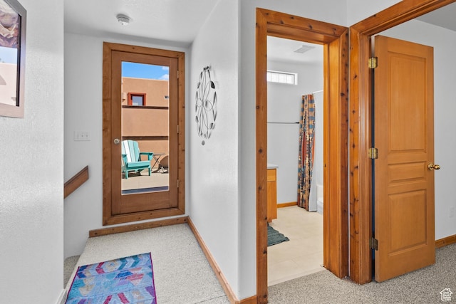 3418 E La Camino, Moab, UT 84532 - hallway featuring baseboards, carpet floors, and a wealth of natural light