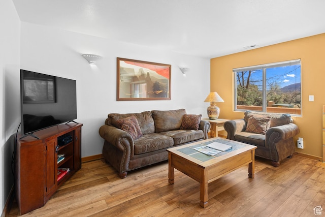 3418 E La Camino, Moab, UT 84532 - living area featuring baseboards, visible vents, and light wood-style flooring