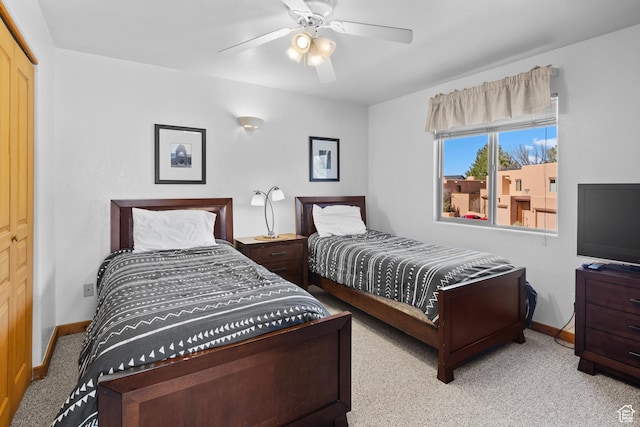 3418 E La Camino, Moab, UT 84532 - bedroom with baseboards, a ceiling fan, and carpet