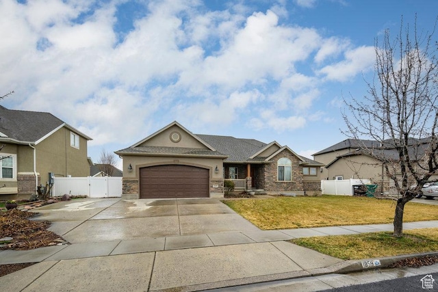 single story home featuring a front yard, an attached garage, fence, a gate, and driveway
