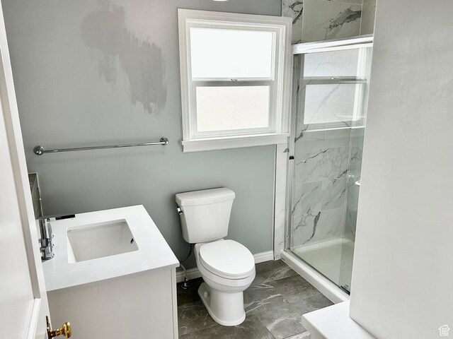 23 W 100 S, Payson, UT 84651 - full bathroom with vanity, a marble finish shower, toilet, baseboards, and marble finish floor
