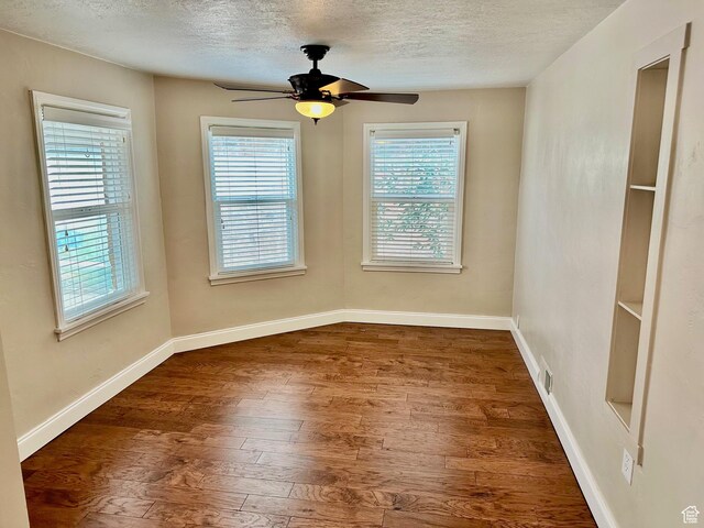 23 W 100 S, Payson, UT 84651 - spare room featuring a textured ceiling, baseboards, ceiling fan, and wood finished floors