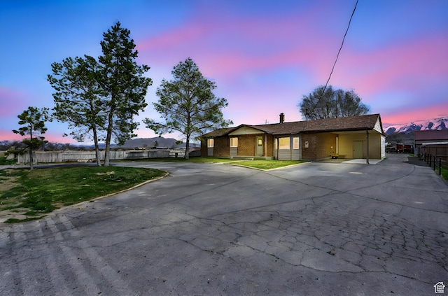 270 N 100 W, Goshen, UT 84633 - view of front facade featuring brick siding, curved driveway, and a chimney