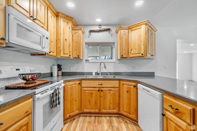 270 N 100 W, Goshen, UT 84633 - kitchen with light wood finished floors, white appliances, dark countertops, and a sink