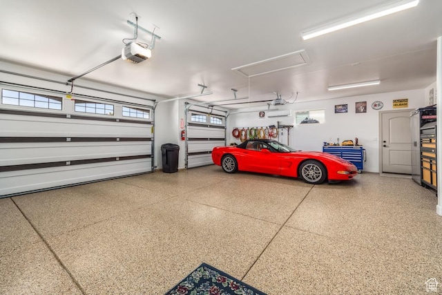 garage featuring a garage door opener