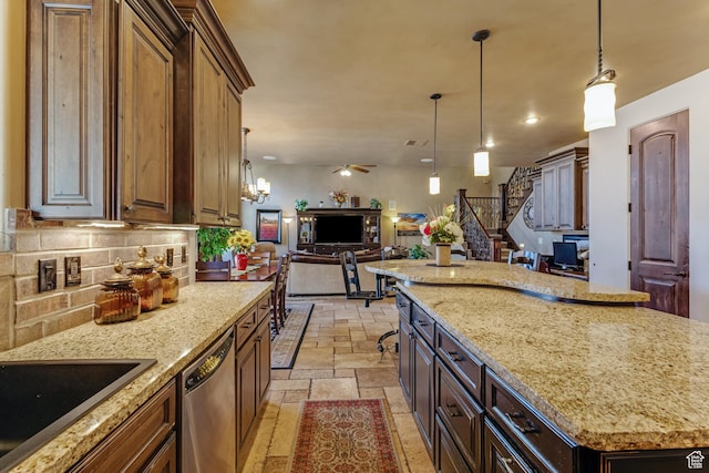 428 N Northstar Dr, St George, UT 84770 - kitchen with stone tile flooring, open floor plan, backsplash, dishwasher, and hanging light fixtures