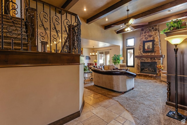 428 N Northstar Dr, St George, UT 84770 - living area with beam ceiling, stone tile floors, baseboards, ceiling fan with notable chandelier, and a fireplace