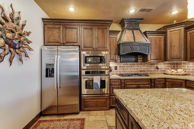 428 N Northstar Dr, St George, UT 84770 - kitchen with premium range hood, tasteful backsplash, light stone countertops, and stainless steel appliances