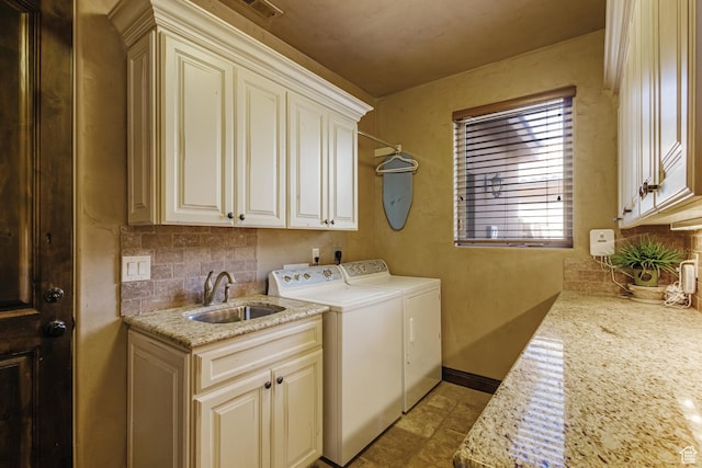428 N Northstar Dr, St George, UT 84770 - laundry area featuring cabinet space, baseboards, separate washer and dryer, and a sink