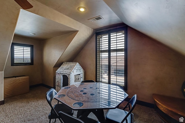 428 N Northstar Dr, St George, UT 84770 - dining area with vaulted ceiling, carpet floors, visible vents, and a healthy amount of sunlight