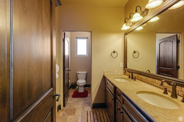428 N Northstar Dr, St George, UT 84770 - full bath with double vanity, stone finish flooring, toilet, and a sink