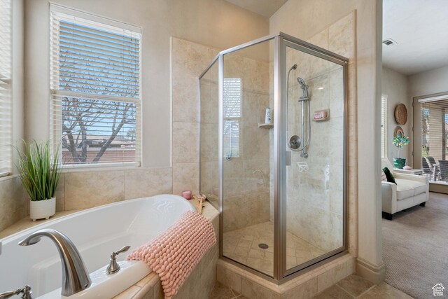 2653 Rio Lobo Dr, St George, UT 84770 - full bathroom featuring a bath, ensuite bath, visible vents, and a shower stall