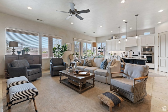 2653 Rio Lobo Dr, St George, UT 84770 - living room featuring light tile patterned flooring, visible vents, ceiling fan, and recessed lighting