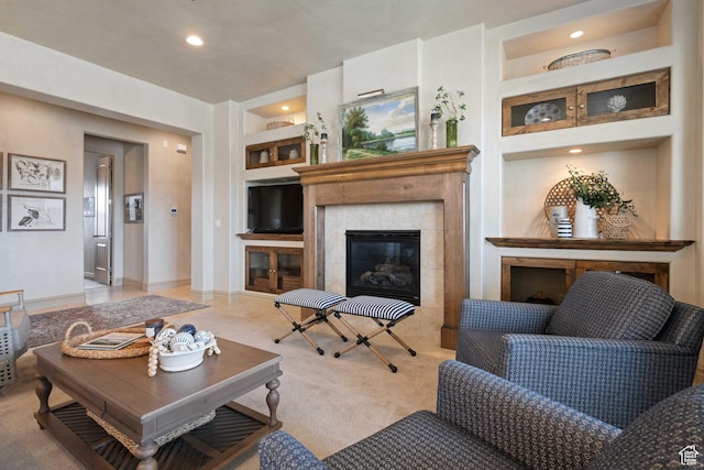 2653 Rio Lobo Dr, St George, UT 84770 - living area featuring carpet, baseboards, a fireplace, built in shelves, and recessed lighting