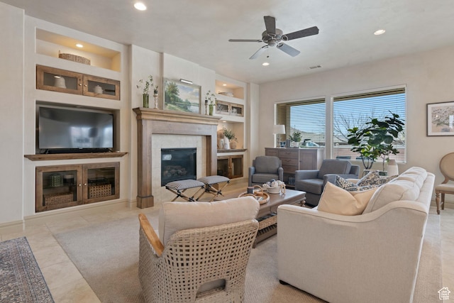 2653 Rio Lobo Dr, St George, UT 84770 - tiled living area with a tiled fireplace, built in features, and recessed lighting