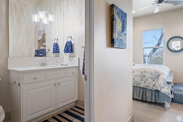2653 Rio Lobo Dr, St George, UT 84770 - bathroom with toilet, vanity, ensuite bath, and ceiling fan