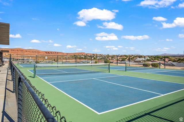 714 N Millcreek Springs Dr, Washington, UT 84780 - view of tennis court with a mountain view and fence