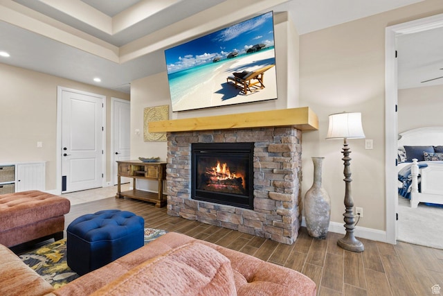 714 N Millcreek Springs Dr, Washington, UT 84780 - living room with wood tiled floors, a fireplace, recessed lighting, and baseboards