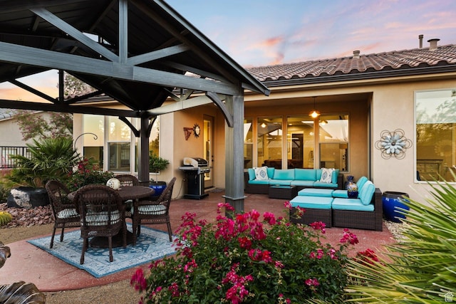 714 N Millcreek Springs Dr, Washington, UT 84780 - patio terrace at dusk featuring an outdoor hangout area, a gazebo, and grilling area
