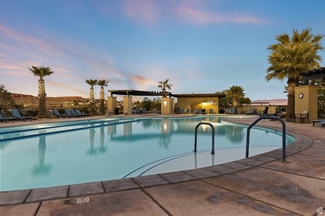 714 N Millcreek Springs Dr, Washington, UT 84780 - pool at dusk with a community pool and a patio
