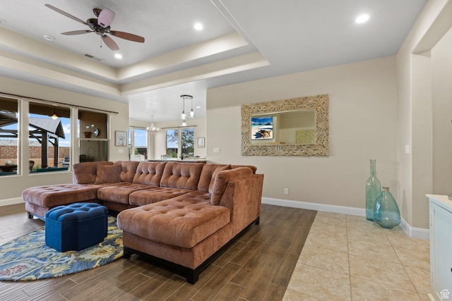 714 N Millcreek Springs Dr, Washington, UT 84780 - living room with a raised ceiling, wood finish floors, baseboards, ceiling fan, and recessed lighting