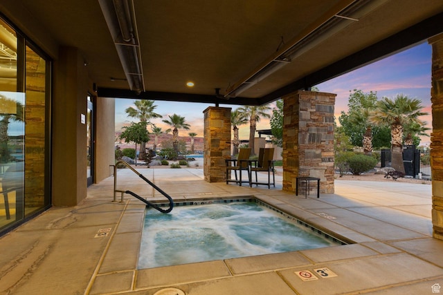 714 N Millcreek Springs Dr, Washington, UT 84780 - pool at dusk featuring a community hot tub and a patio area