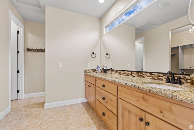 714 N Millcreek Springs Dr, Washington, UT 84780 - bathroom with baseboards, double vanity, and tile patterned flooring