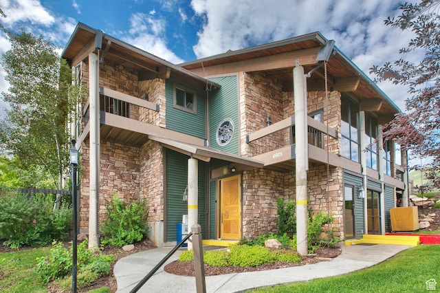 6861 N 2200 W Unit 9D, Park City, UT 84098 - view of front of property featuring stone siding and a balcony