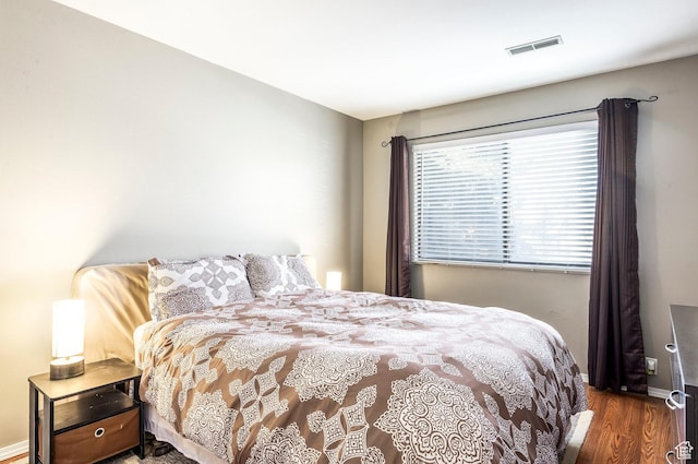 6861 N 2200 W Unit 9D, Park City, UT 84098 - bedroom featuring wood finished floors, baseboards, and visible vents