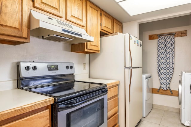6861 N 2200 W Unit 9D, Park City, UT 84098 - kitchen with light tile patterned flooring, light countertops, stainless steel range with electric stovetop, washer / clothes dryer, and under cabinet range hood