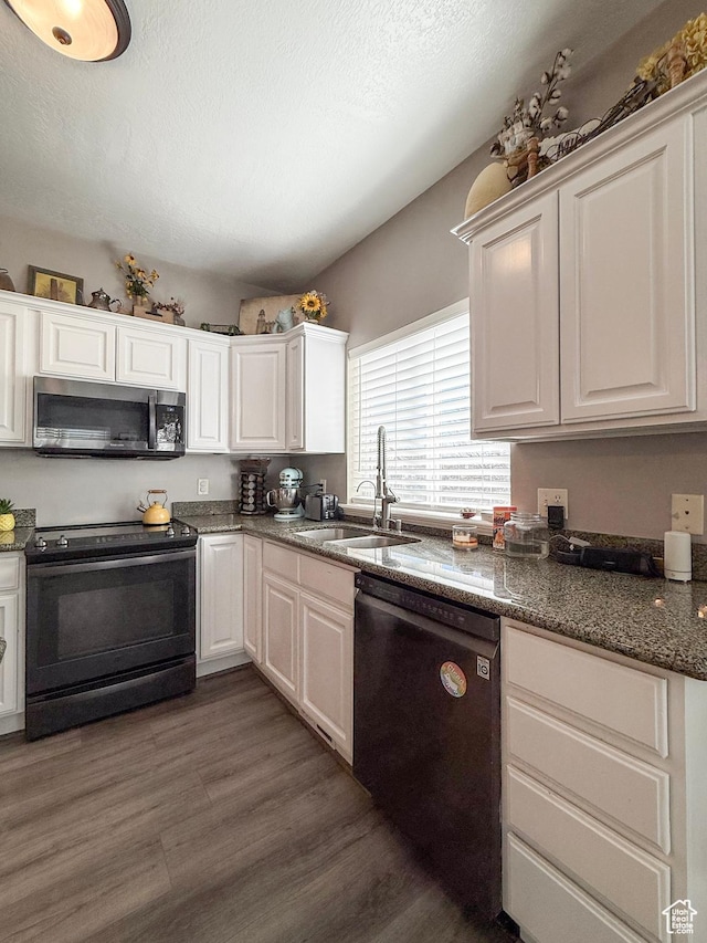 2016 E Cedar Trails Way, Eagle Mountain, UT 84005 - kitchen with black appliances, a sink, and white cabinetry
