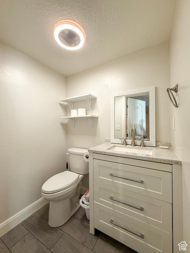 2016 E Cedar Trails Way, Eagle Mountain, UT 84005 - half bath featuring a textured ceiling, toilet, vanity, wood finished floors, and baseboards