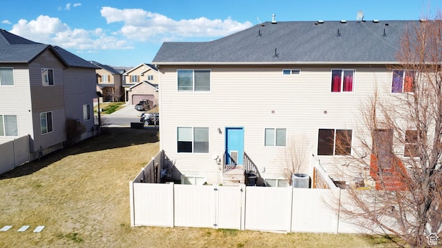2016 E Cedar Trails Way, Eagle Mountain, UT 84005 - back of property featuring central air condition unit, a residential view, and roof with shingles