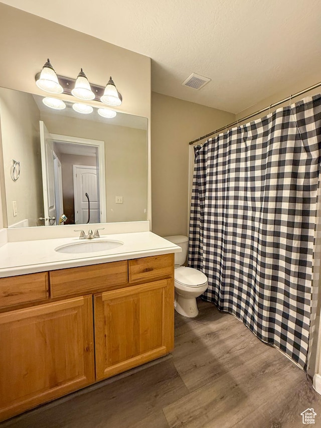 2016 E Cedar Trails Way, Eagle Mountain, UT 84005 - full bath featuring wood finished floors, vanity, toilet, and curtained shower