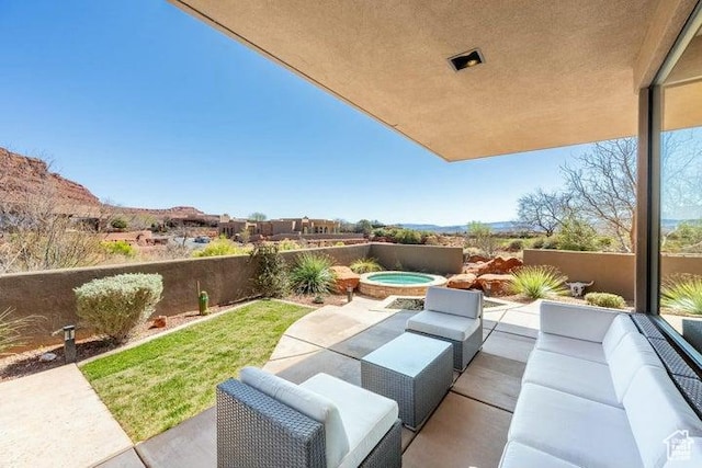 3052 N Snow Canyon Pkwy Unit 36, St George, UT 84770 - view of patio featuring an outdoor hangout area, an in ground hot tub, and fence