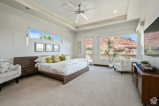 3052 N Snow Canyon Pkwy Unit 36, St George, UT 84770 - bedroom featuring multiple windows, access to exterior, and a raised ceiling