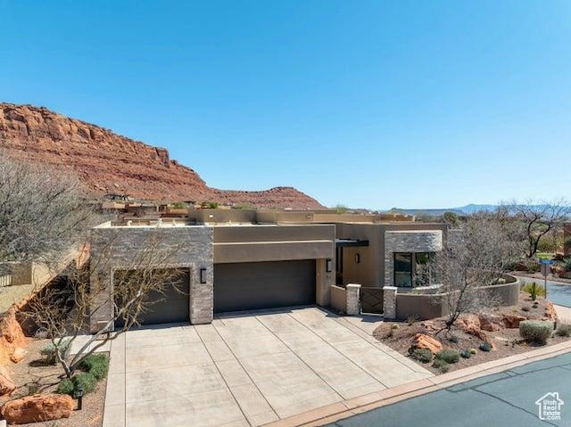 3052 N Snow Canyon Pkwy Unit 36, St George, UT 84770 - southwest-style home with stucco siding, a garage, concrete driveway, and a mountain view
