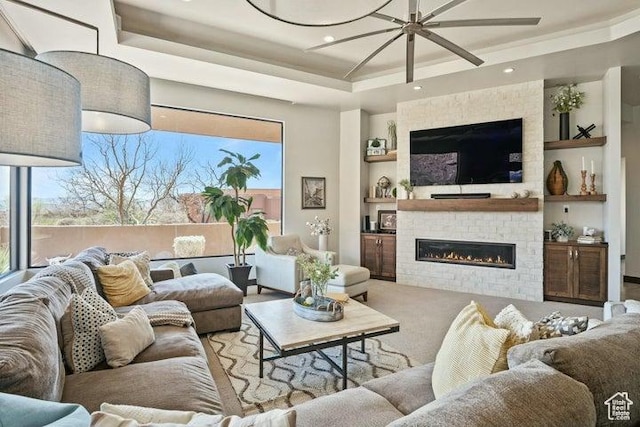 3052 N Snow Canyon Pkwy Unit 36, St George, UT 84770 - living room with a fireplace, a wealth of natural light, built in shelves, and a raised ceiling