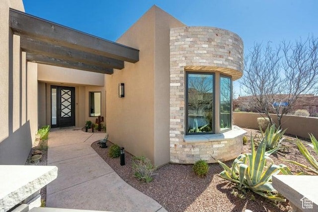3052 N Snow Canyon Pkwy Unit 36, St George, UT 84770 - view of exterior entry featuring stucco siding and stone siding