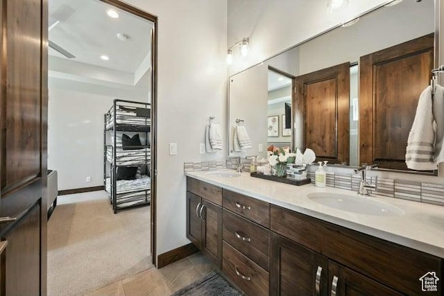 3052 N Snow Canyon Pkwy Unit 36, St George, UT 84770 - bathroom with double vanity, baseboards, and a sink