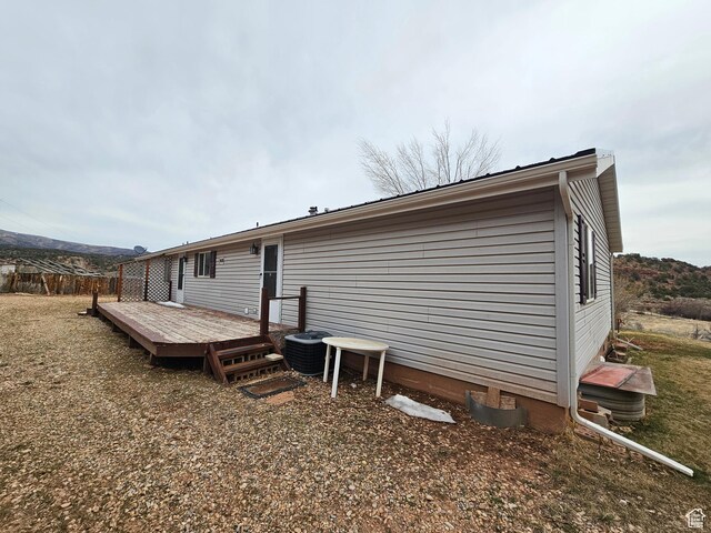 2350 S Red Creek Rd, Fruitland, UT 84027 - rear view of house with central air condition unit and a wooden deck