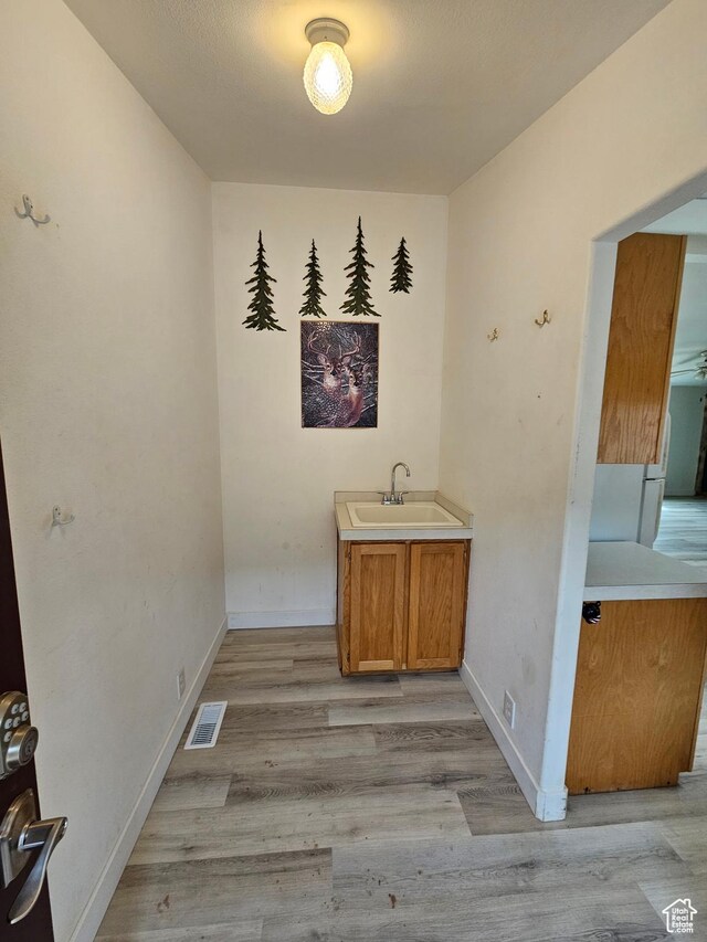 2350 S Red Creek Rd, Fruitland, UT 84027 - interior space with baseboards, visible vents, wood finished floors, and a sink