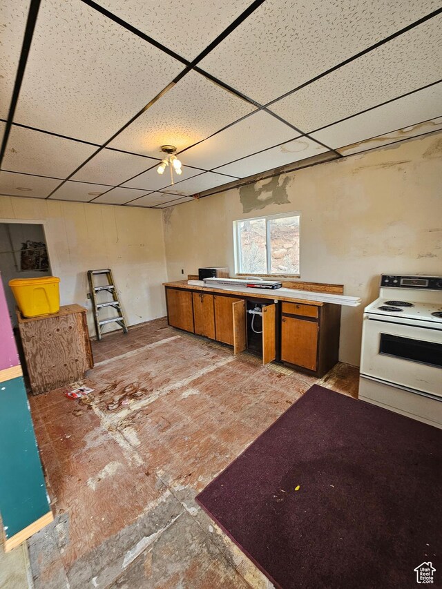 2350 S Red Creek Rd, Fruitland, UT 84027 - kitchen with brown cabinets, a drop ceiling, and electric range