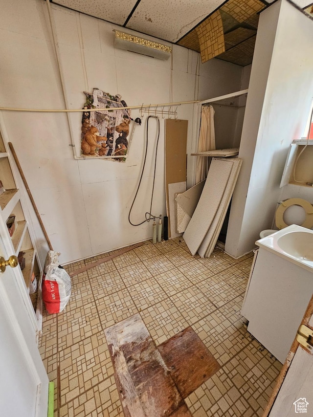 2350 S Red Creek Rd, Fruitland, UT 84027 - bathroom with a drop ceiling, a shower with shower curtain, and vanity