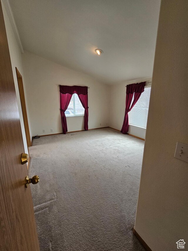 2350 S Red Creek Rd, Fruitland, UT 84027 - carpeted empty room with baseboards and lofted ceiling