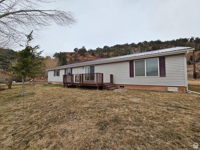 2350 S Red Creek Rd, Fruitland, UT 84027 - view of front of house with metal roof, a front lawn, a wooden deck, and crawl space