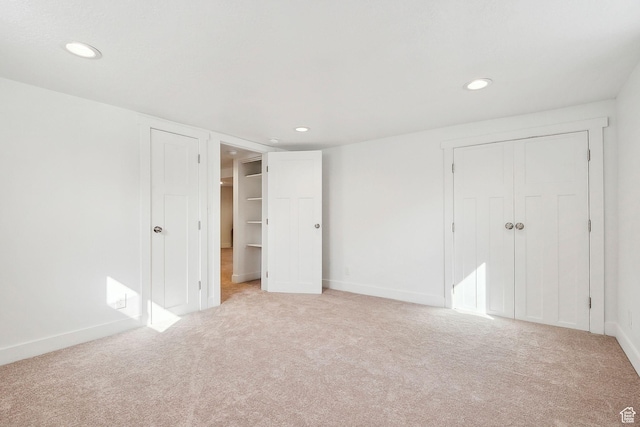 1138 E Hudson Ave, Salt Lake City, UT 84106 - unfurnished bedroom with a closet, light colored carpet, and recessed lighting