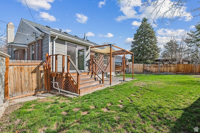 1138 E Hudson Ave, Salt Lake City, UT 84106 - back of property featuring a wooden deck, a fenced backyard, and a lawn