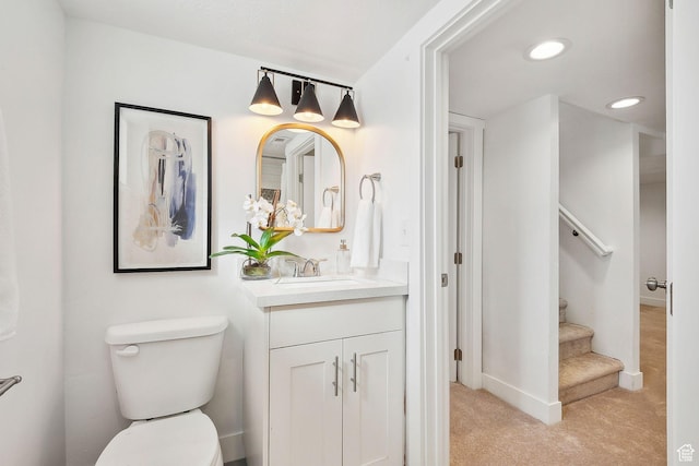 1138 E Hudson Ave, Salt Lake City, UT 84106 - bathroom with baseboards, toilet, recessed lighting, and vanity
